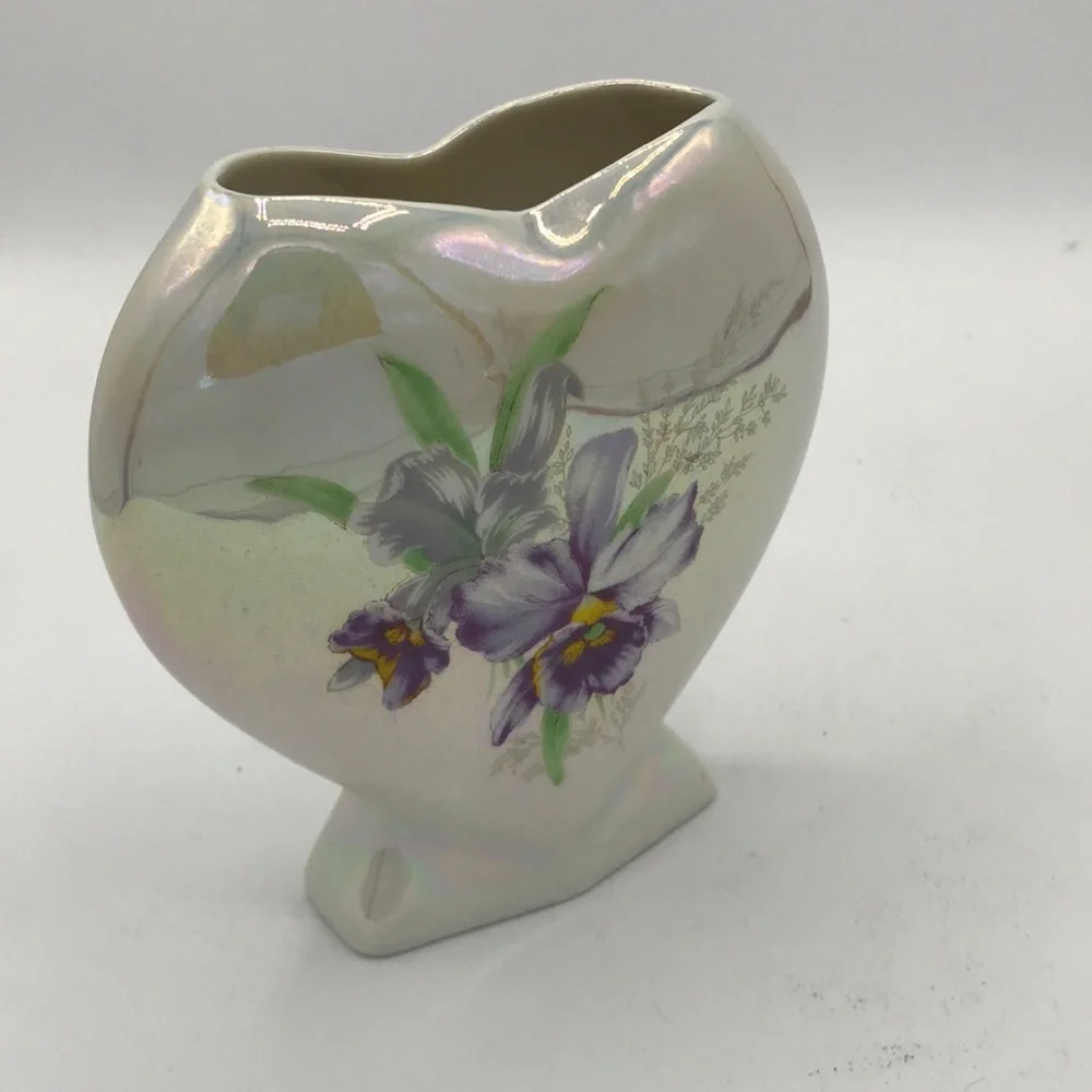 Iridescent heart-shaped vase with purple flower design